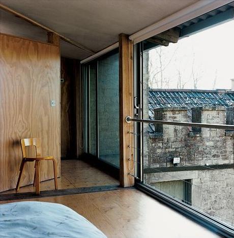 Old cottage renovated interior with wooden wall and floor and large window