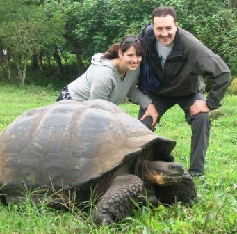 4 Years of Travel Blogging and Living in Germany In the Galapagos posing with a gigantic tortoise.