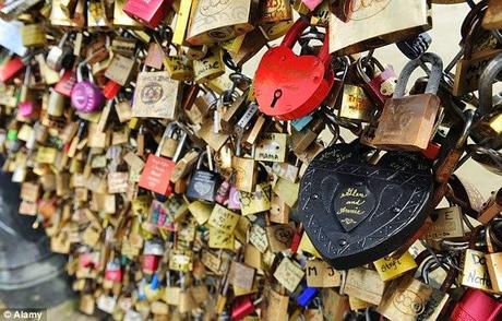 tying wishes to tree .... section of Parisian bridge collapses by padlock weight