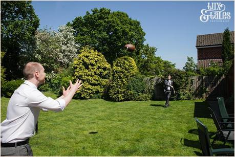 groomsmen play football at Altrincham wedding 