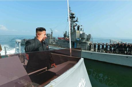Kim Jong Un salutes KPA Navy service members from a warship following an island landing drill (Photo: Rodong Sinmun).