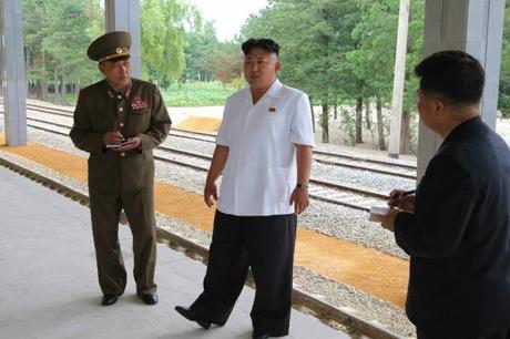Kim Jong Un tours the construction of Songdowon Railway Station.  Also seen in attendance is Director of the NDC Design Department Ma Won Chun (left) and WPK Finance and Accounting Department Director Han Kwang Sang (right) (Photo: Rodong Sinmun).