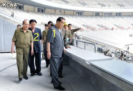 DPRK Premier Pak Pong Ju (1) visits the renovation of the May Day Stadium in Pyongyang.  Also seen in attendance is Ro Tu Chol (2), DPRK Vice Premier and Chairman of the State Planning Commission (Photo: KCNA).