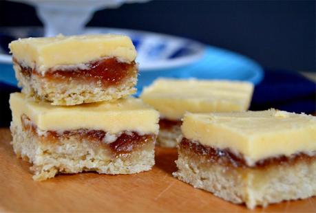 cookie bars topped with rhubarb jam and a custard flavoured icing