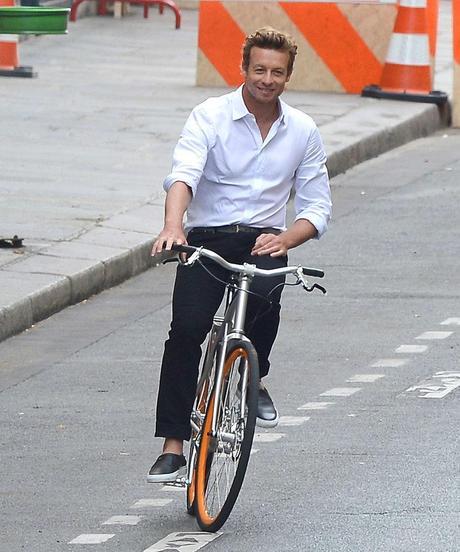 Simon Baker rode bike around Paris Monday while filming mens fashion 