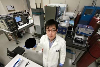 Xinwei Cui holds one of the nano-engineered carbon components of the new battery technology
