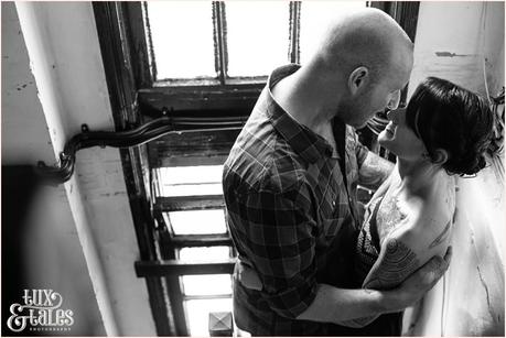 Kissing in the stairwell at Hyde Park Picture House Engagement shoot