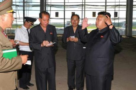 Kim Jong Un talks with civil aviation officials during a tour of the construction of a terminal at Pyongyang Airport (Photo: Rodong Sinmun).
