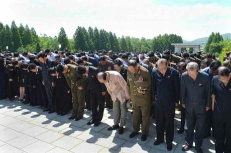 Members of Jon Pyong Ho's family and members of his national funeral committee bow during a graveside service at Patriotic Martyrs' Cemetery in Pyongyang on 10 July 2014 (Photo: Rodong Sinmun).