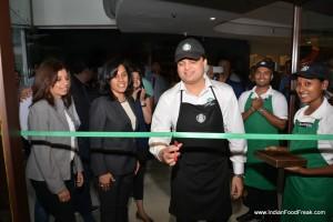 India's first Starbucks Coffee Master Vibhor Mishra cuts the ribbon alongside Tata Starbucks Ltd CEO Avani Davda-1