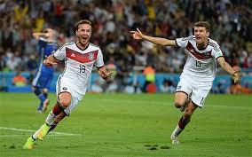 Mario Götze celebrating his moment in history with Thomas Müller