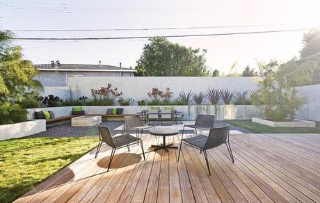 California house backyard with wooden deck and lounge seating