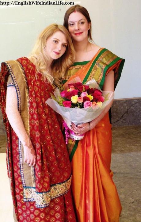 sister in india red saree mango saree flowers