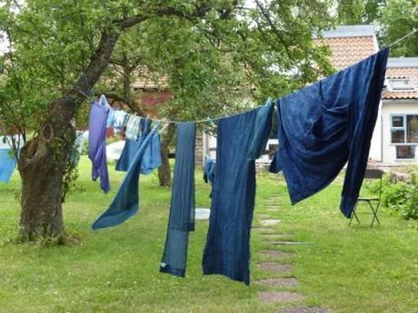 Indigo dyed fabric and clothes drying on a washing line
