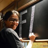 Aditi completing wall art