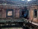 Travis at the corner of the inner wall of the temple