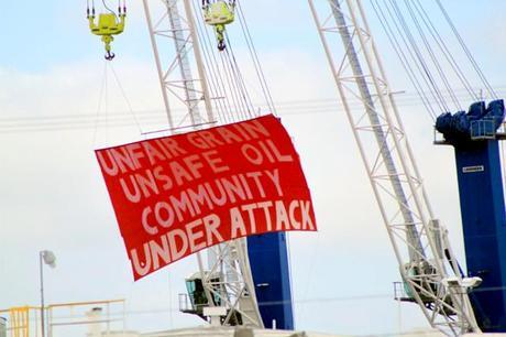 The International Longshore and Warehouse Union raised a banner from cranes calling out unfair labor practices and protesting unsafe oil at the Port of Vancouver in Washington.