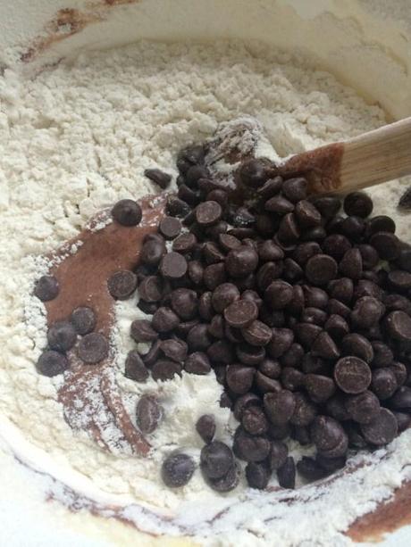 mixing dark chocolate chips into cocoa batter with flour to prevent sinking