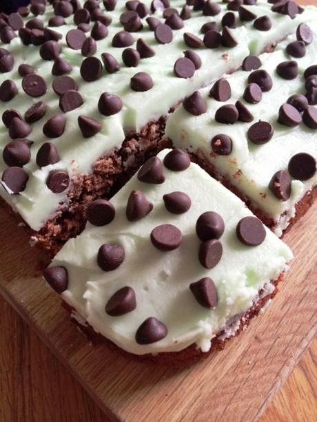 corner section of tray bake mint icing dark chocolate chips brownie cake base