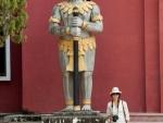 Sonya and a giant statue at the Provincial Court