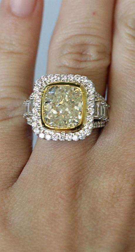 Fancy yellow diamond engagement ring with halos