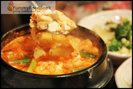 Spicy soft tofu soup with egg and crab meat 