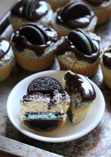 Mint Cookies & Cream Cupcakes | A vanilla cupcake with a Mint Oreo at the bottom, Mint Oreo buttercream, & chocolate ganache. #Recipe from Bakerita.com