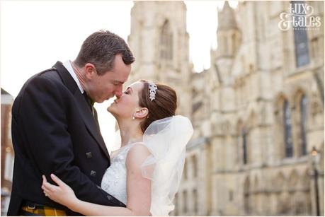 Bride & groom kissi n front fo York Minster Wedding Photography