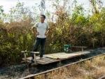 Our bamboo train driver waiting for the other train to pass