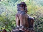 Mythical lion statue at the start of the stairs