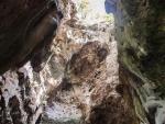 Looking up towards the skylight of the killing caves