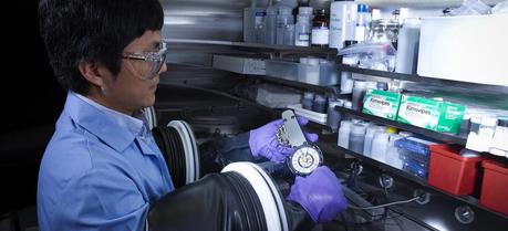 PNNL materials scientist Xiaochuan Lu assembles a sodium-beta battery in a glove box. He and his colleagues have developed a new liquid metal alloy electrode that allows sodium-beta batteries to operate at significantly lower temperatures, which enables the batteries to last longer, helps streamline their manufacturing process and reduces the risk of accidental fire.