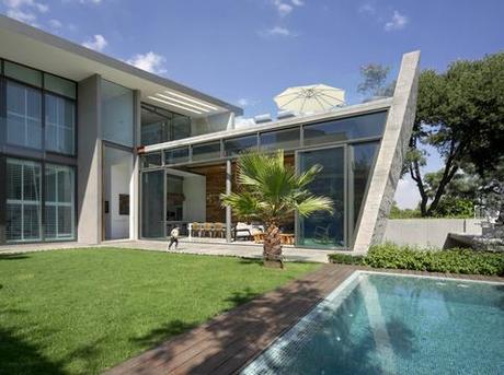 L-shaped home in Mexico City with a lawn and pool