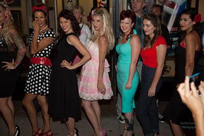 Artist Cedar Lee with pinup models during Escondido's Cruisin' Grand, August 2014