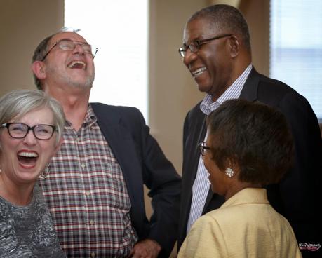 One Final Photo from Our Wedding Celebration: Friends Sharing a Laugh