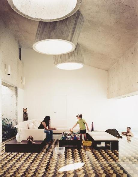 Modern concrete living room with skylights