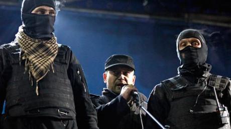 Dmytro Yarosh, head of the Ukrainian Nazi Right Sector group, speaking at a rally with two of his thugs.