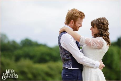 Bride and groom in an althrincham field. Tux & Tales Photography relaxed and natural photos 