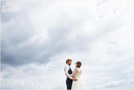 Bride and groom in an althrincham field. Tux & Tales Photography relaxed and natural photos 