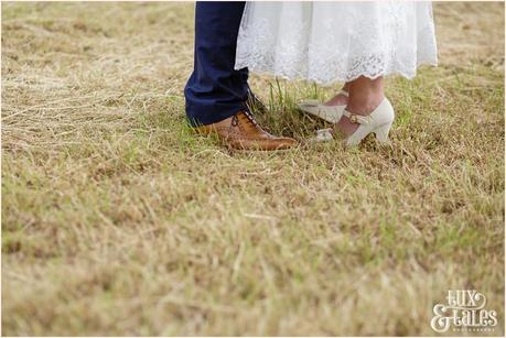 Bride and groom in an althrincham field. Tux & Tales Photography relaxed and natural photos 