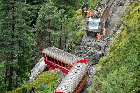 Swiss mountain rail details in deep wooded walley at Graubuenden