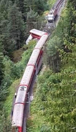 Swiss mountain rail details in deep wooded walley at Graubuenden