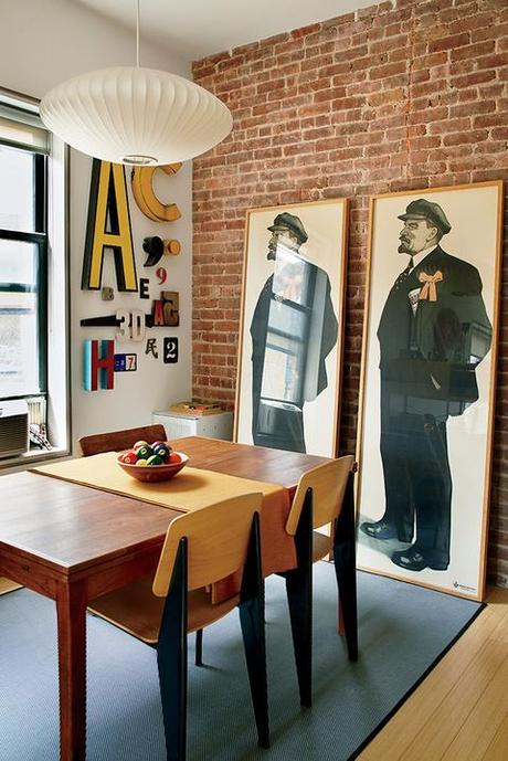 Dining room with Jean Prouvé chairs and Lenin prints
