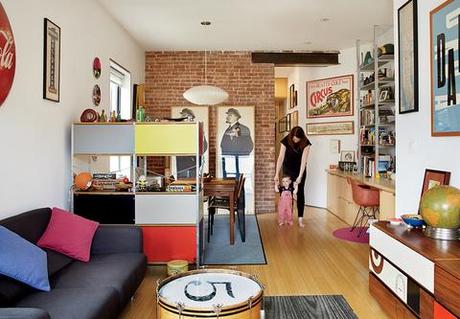 Bright living area with Eames storage unit and graphic prints