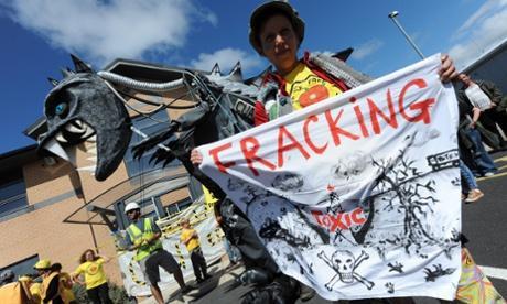 Protesters prop up ‘Cuadzilla monster’ at offices leased by Cuadrilla in Blackpool, England. Photograph: Peter Powell/EPA