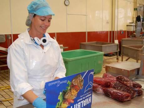 A factory worker packages whale meat on the islet of Skrova, near Svolvaer