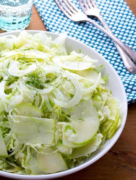 Apple, Fennel & Brussels Sprouts Slaw- a fresh, crunchy salad tossed in an apple cider vinaigrette.  Ready in 15 minutes!