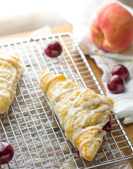 Cherry & Peach Turnovers with a Sweet Bourbon Glaze.  Ready in under 40 minutes!  | sweetpeasandsaffron.com