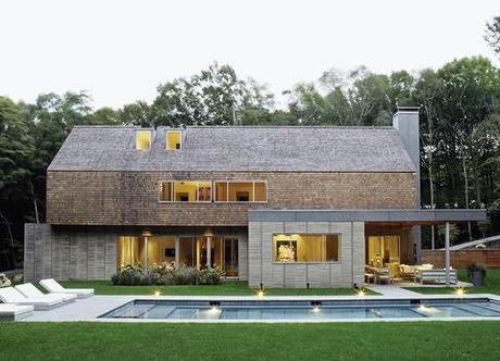 Hamptons modern pool off gabled house with cedar paneling