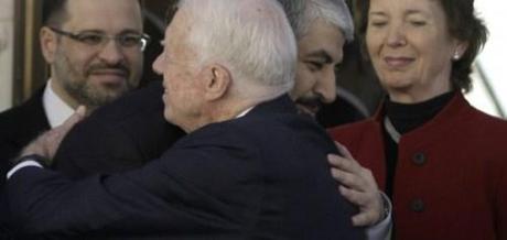 Former President Jimmy Carter embracing Hamas leader Khaled Mashaal 